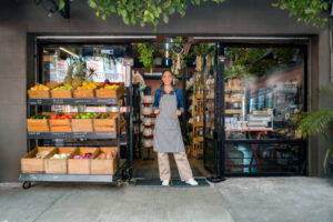 Happy woman at a local food market