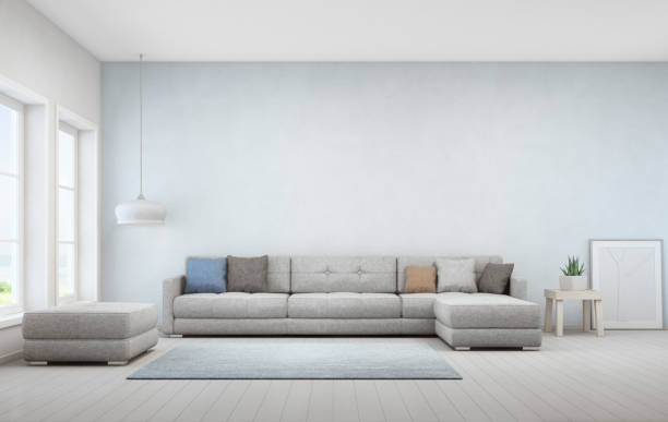 A large sofa sitting in a minimalistic living room