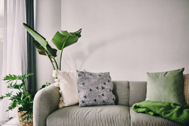 A sofa in a minimalistic living room with throw pillows