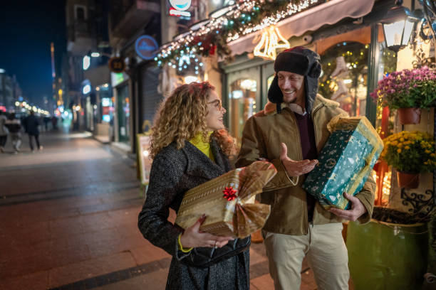 Young couple enjoy shopping Christmas gifts.