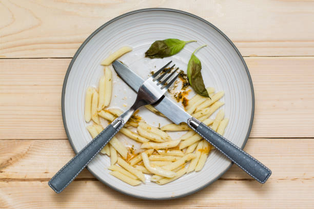 Food remaining in plate after eating, causing food waste in restaurants