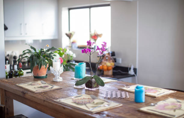 An empty dinner table set up for visitors in a flat