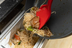 disposing food in trash can which causes food waste in restaurants