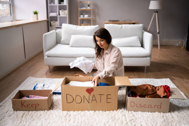 A Lady Donating Decluttering And Cleaning Up Her Belongings